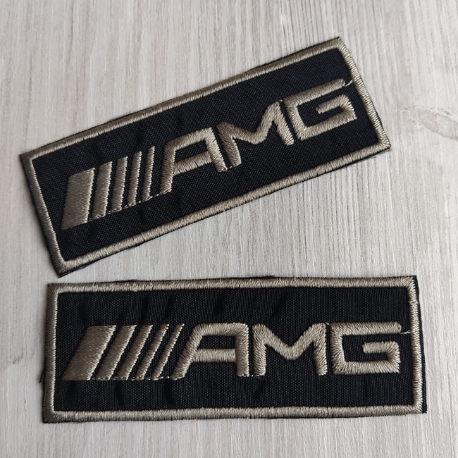 Нашивка клейова, чорна з оливковим написом 80х30 мм.