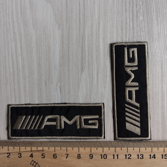 Нашивка клейова, чорна з оливковим написом 80х30 мм.