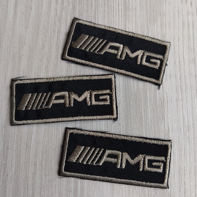 Нашивка клейова, чорна з оливковим написом 47х20 мм