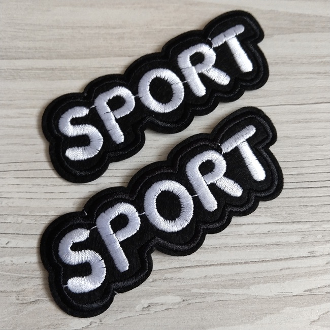 Нашивка клейова, Спорт, чорна з білим написом 95х35 мм